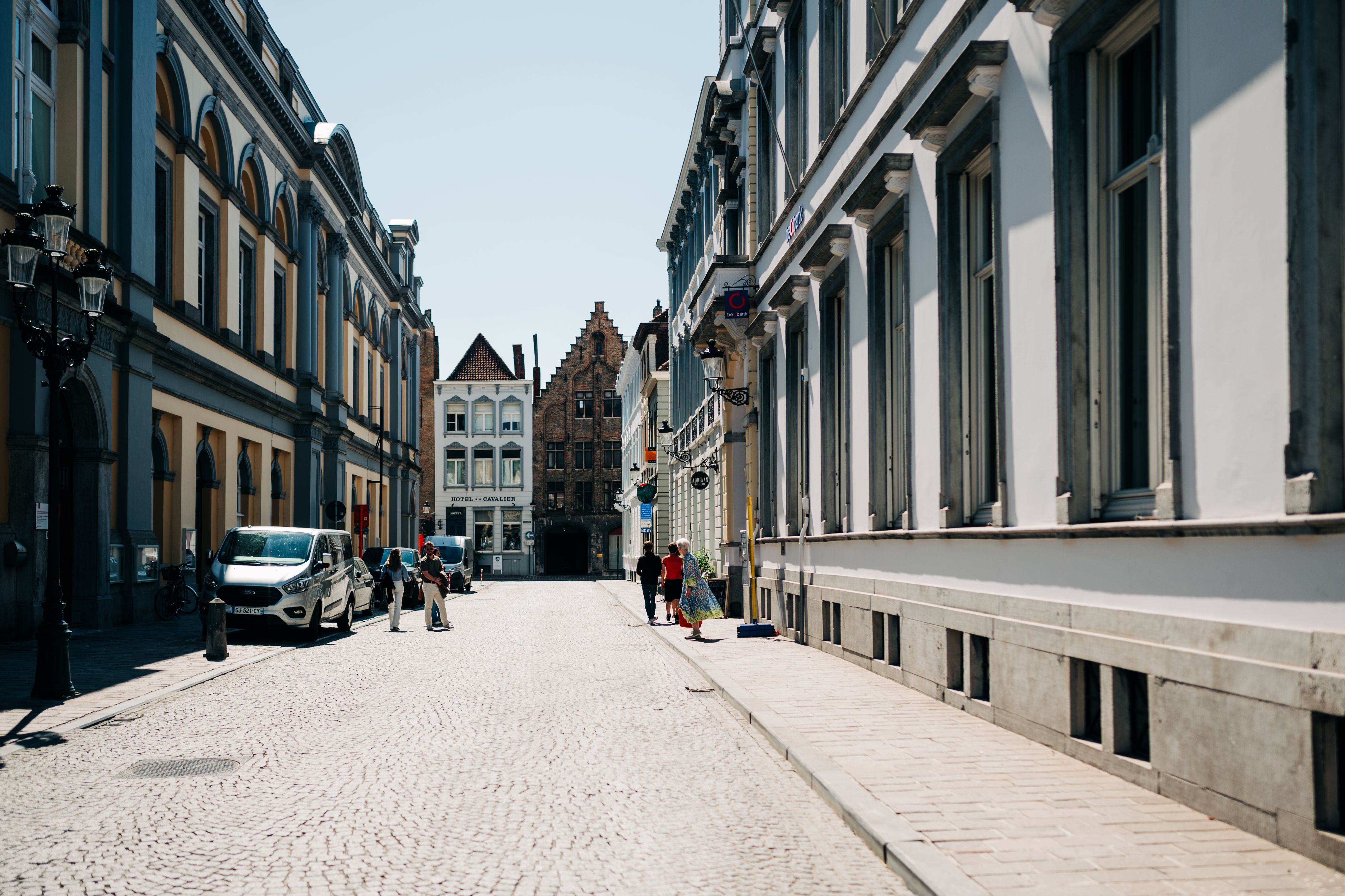Cobblestone street and historic townhouses in Bruges, Belgium