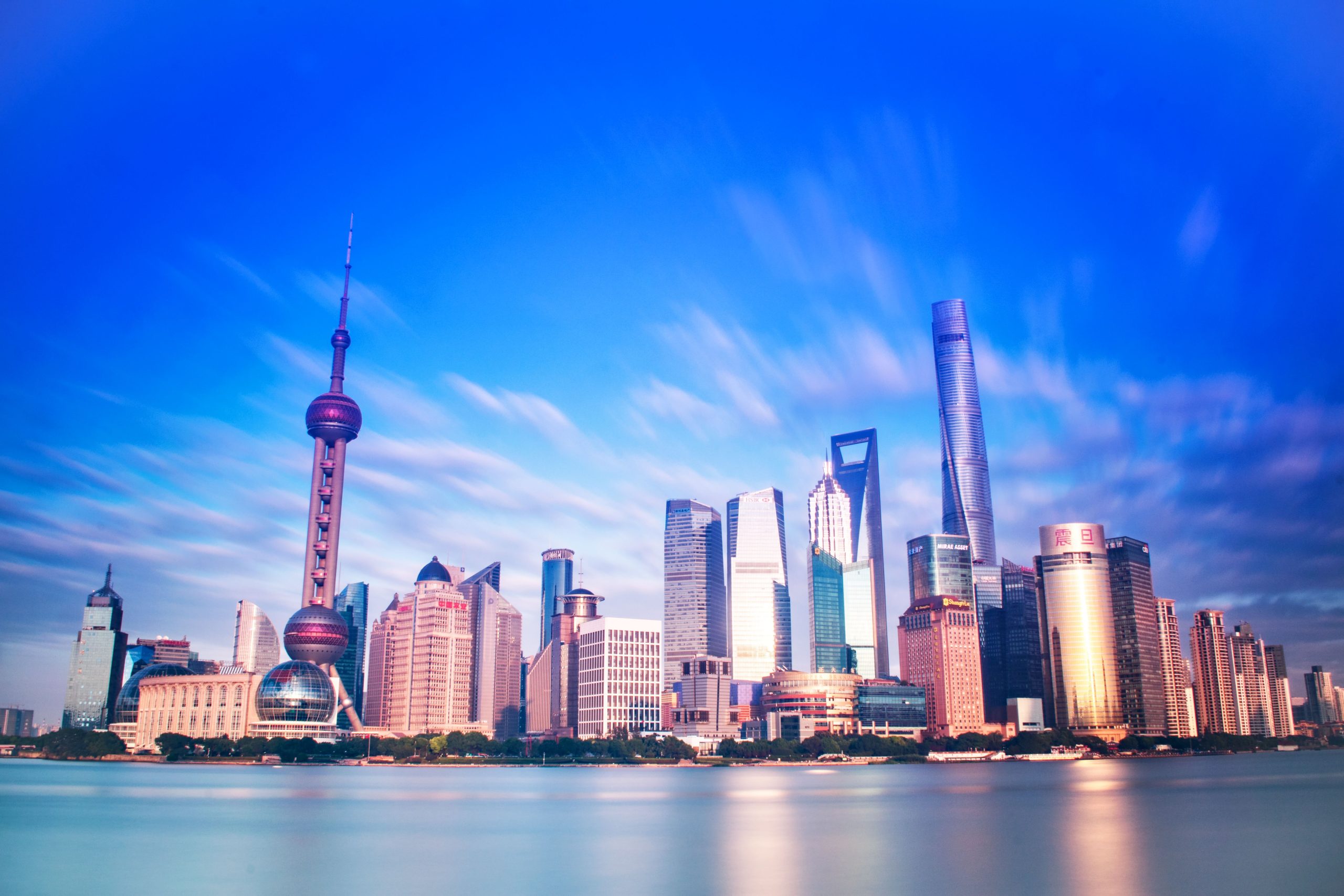 Vibrant Shanghai skyline featuring the Oriental Pearl Tower and modern skyscrapers.